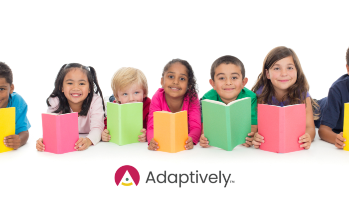 A group of kids holding books with different color
